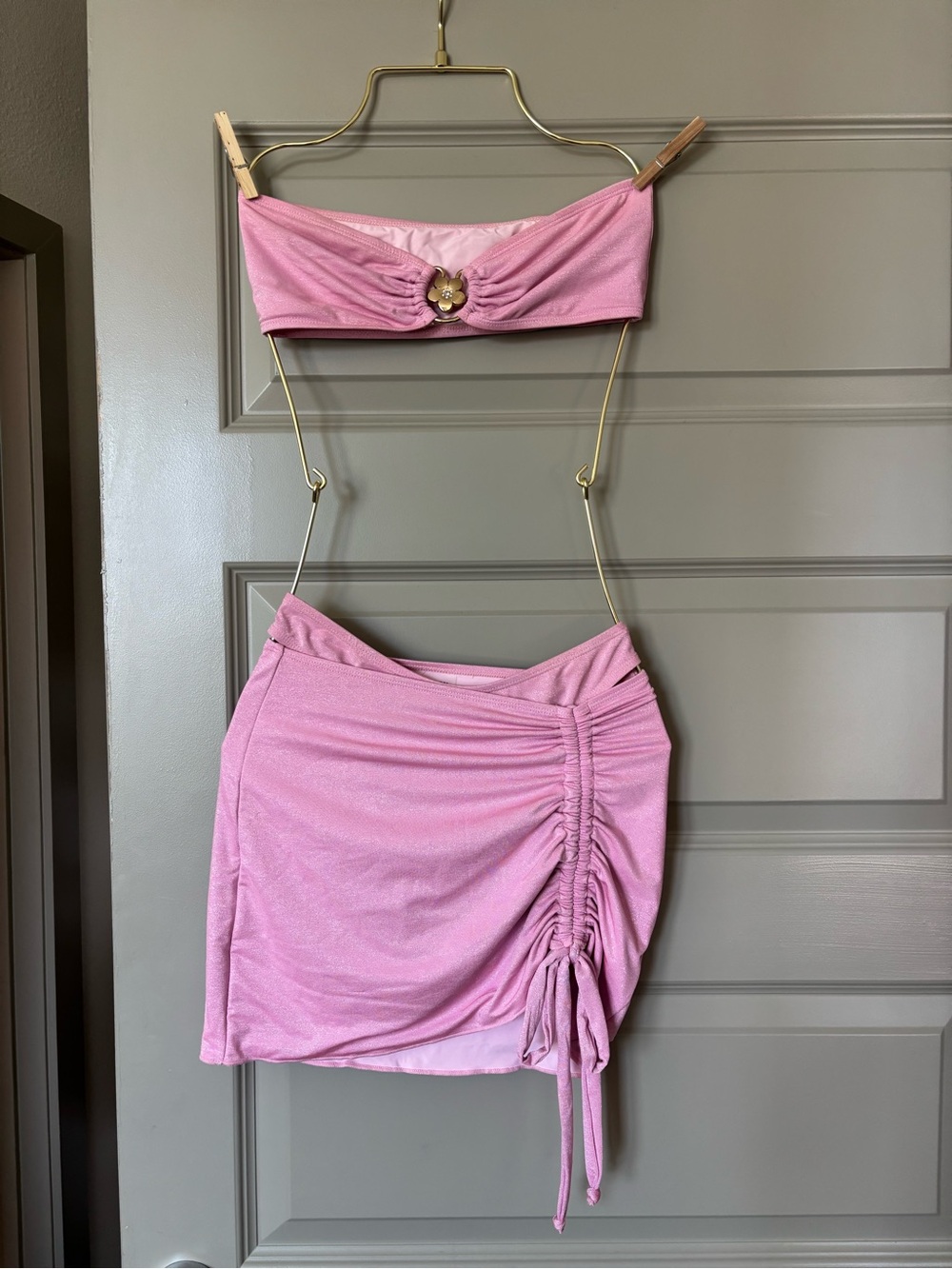 Haute Swimwear pink bandeau bikini with cheeky bottoms and drawstring skirt